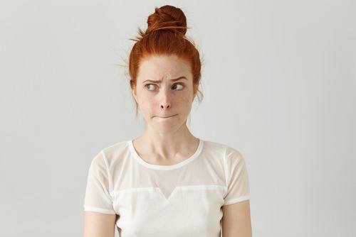 woman appearing unhappy